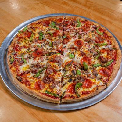 Whole Vegetarian Pizza served on a metal tray.