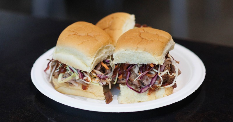 Plete of three sliders with pork and coleslaw