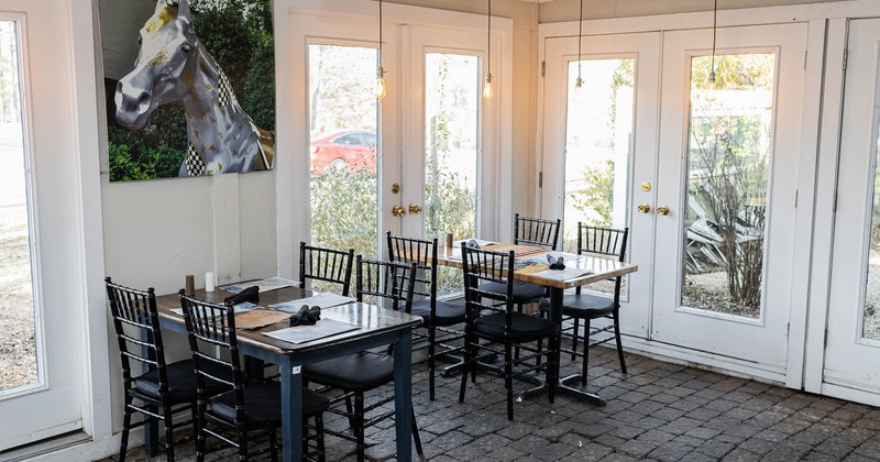 Interior, tables and chairs near doors