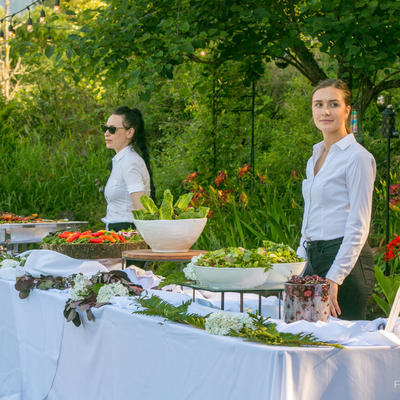 Two staff members working with food