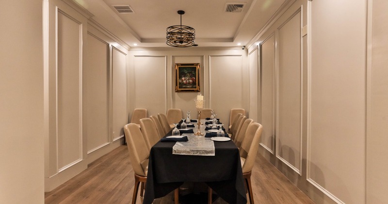 Interior, table set for guests in dining area