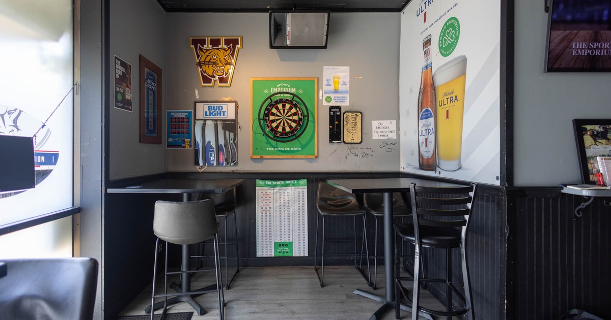 Interior, tall tables and bar stools, dart board