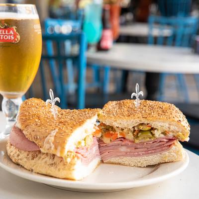 Mufaletta sandwich and a glass of beer