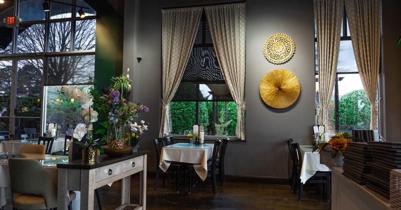 Interior, tables with chairs, decorations on the walls