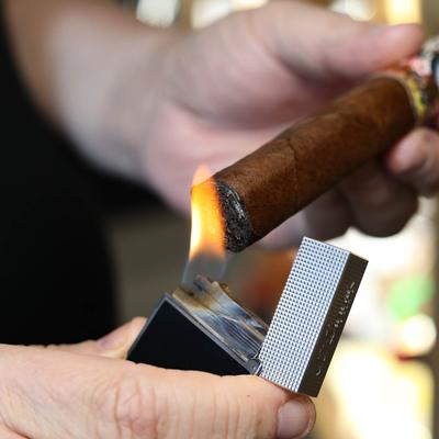 Lighting a cigar, closeup
