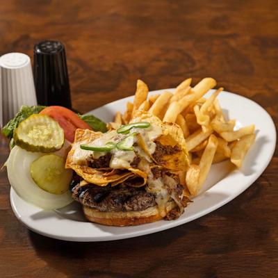 Nacho Spicy Burger, served with a side of fries.