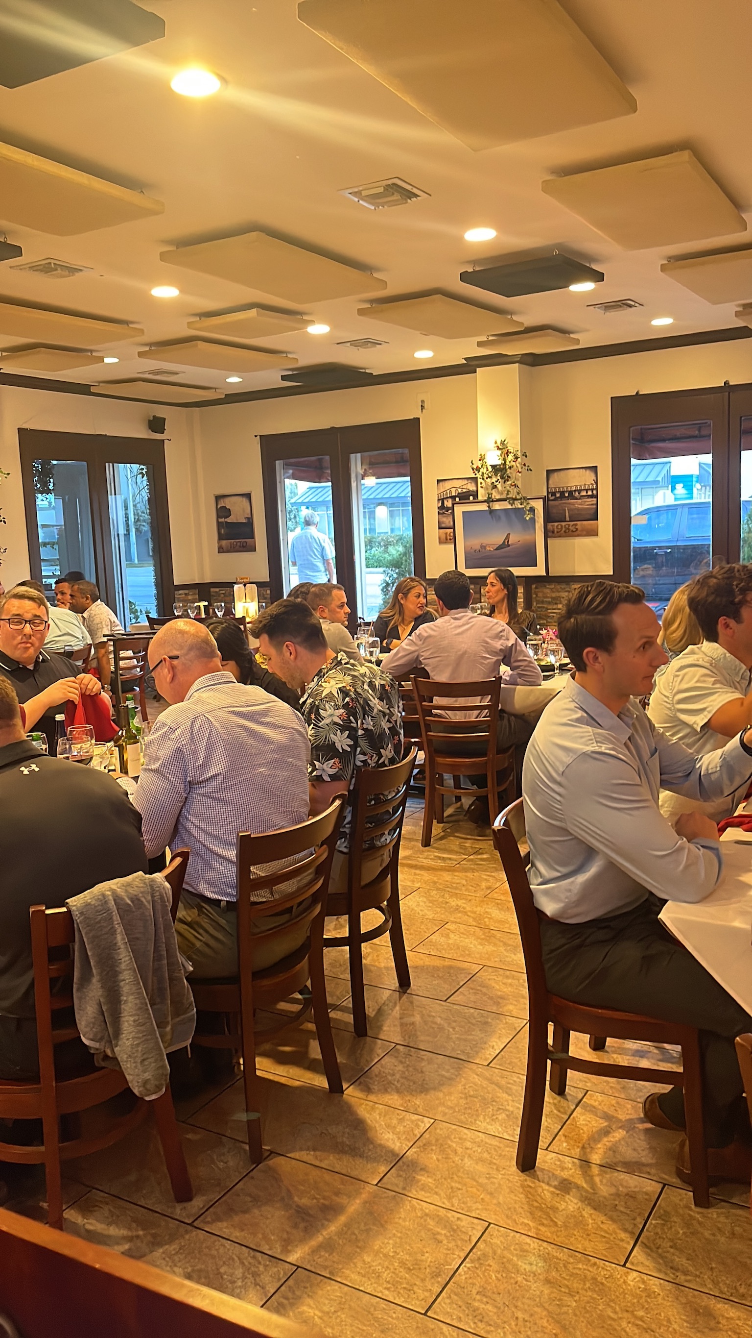 Crowded dining room with guests at tables