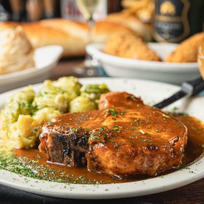Pork Chop in Homemade Gravy with Brussels Sprouts.