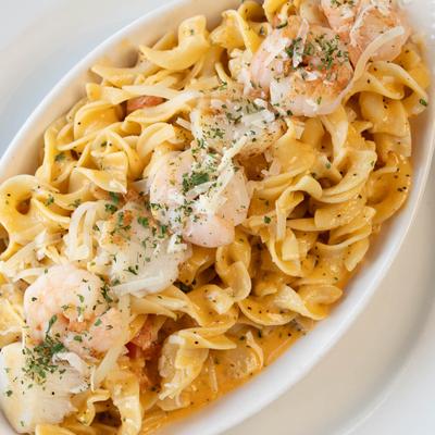 Shrimp and Scallops in a sauce, served over Greek egg noodles.