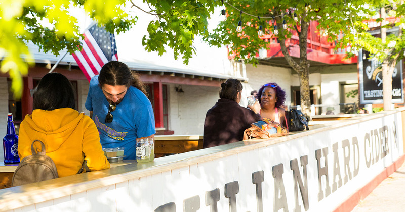 Exterior, seated guests enjoying drinks
