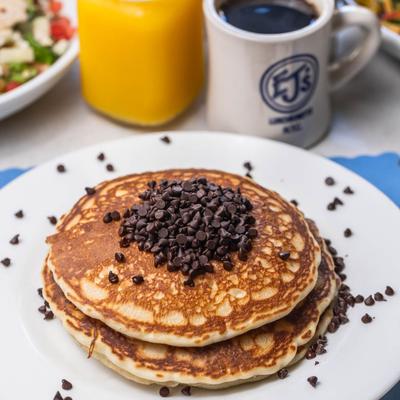 EJ's famous chocolate chip pancakes with coffee and orange juice.