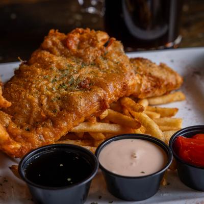 Beer-battered haddock with fries and dipping sauces.