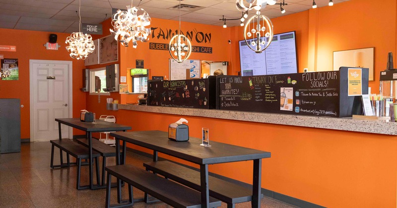 Interior, tables and benches in dining area