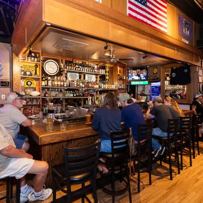 Guests sitting at the bar and chatting