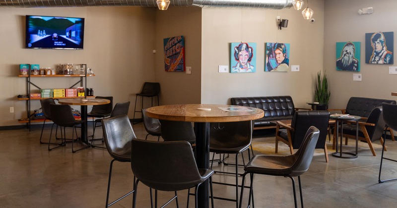 Interior, seating area with guest's tables and chairs