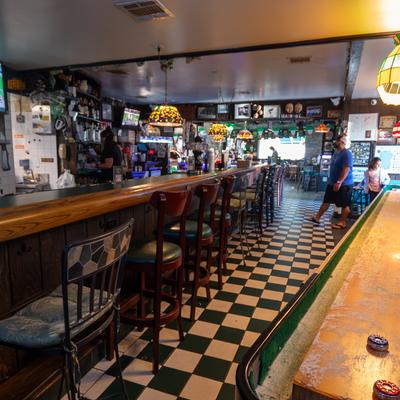 Bar area, chairs, drink rack behind