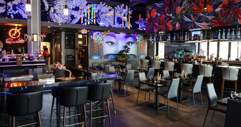 Modern and spacious restaurant interior dining area with Japanese-style decorations, and bar area