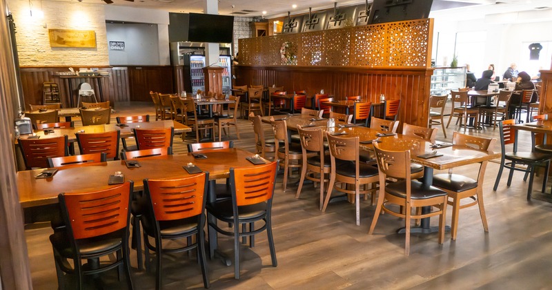 Interior space, dining area, tables ready for guests