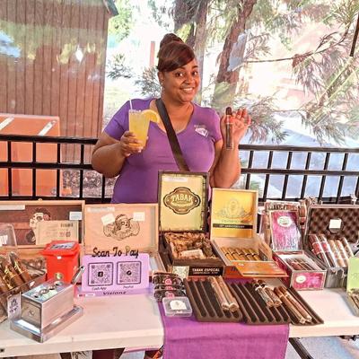 Customer next to a table with cigars.