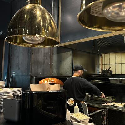Chef cooking in a restaurant kitchen.
