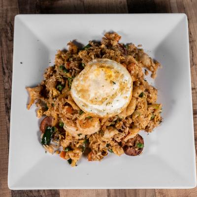 Cajun fried rice topped with fried egg.