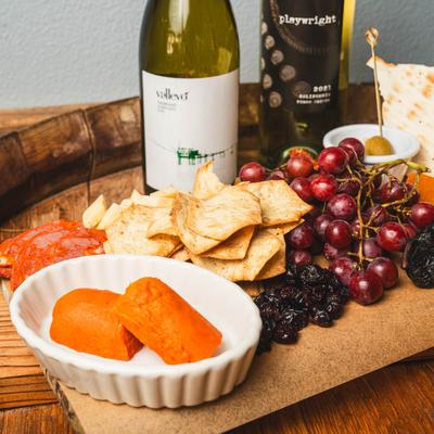 Hot blooded signature charcuterie board and wine.