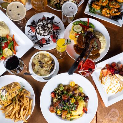 Various dishes and drinks on a table.