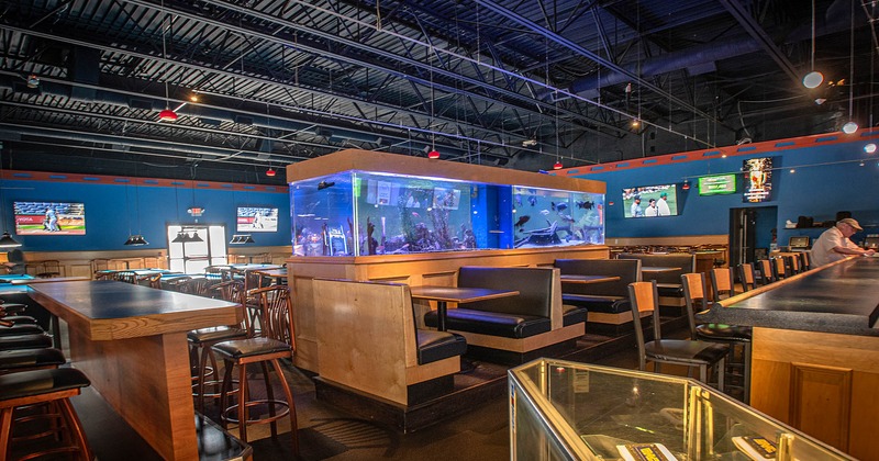 Interior, seating area with giant fish tank in the middle