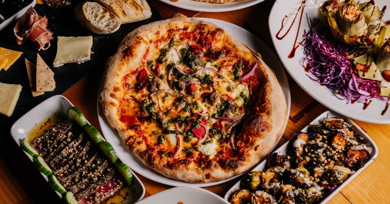 A variety of dishes spread on a table, overhead view