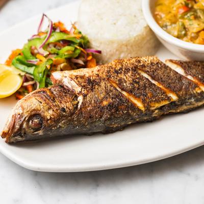 A traditional Senegalese whole branzino fish.