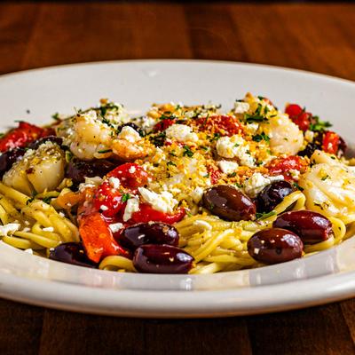 Shrimp and scallops pasta with red peppers, kalamata olives and feta.