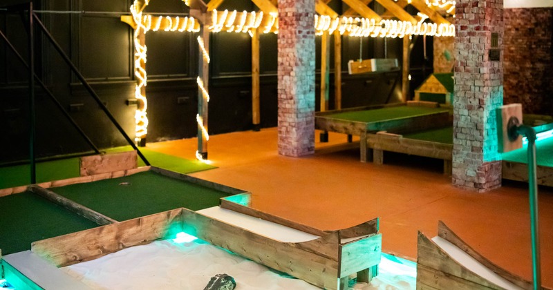 A miniature golf course with various intricate obstacles