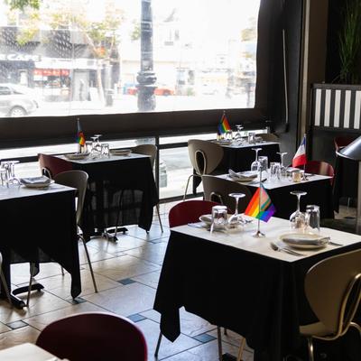Elegant dining area, set tables for two.