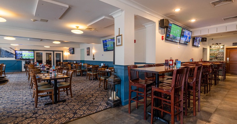Interior, seating area with tables, chairs and stools