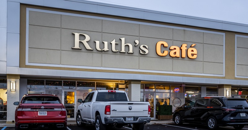 Exterior,front view to restaurant, entrance, parking lot in front, pick up truck, sign above