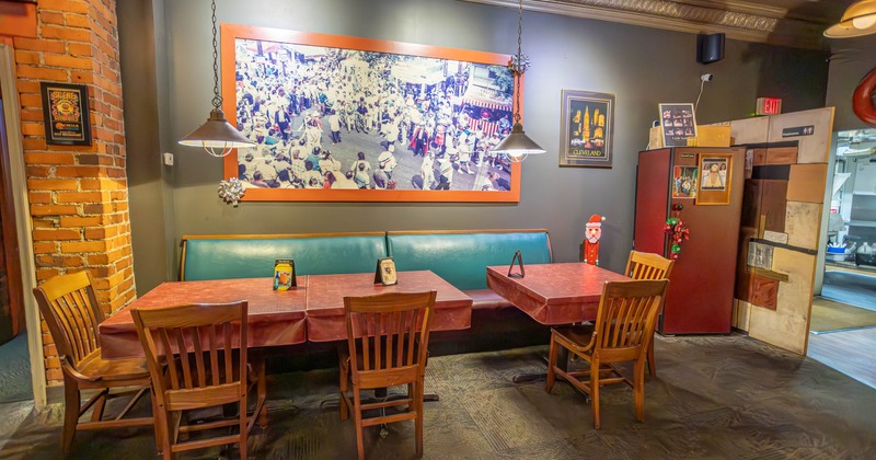 Tables with chairs and a leather sofa set