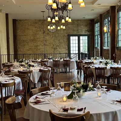 Large dining area with fully set tables.