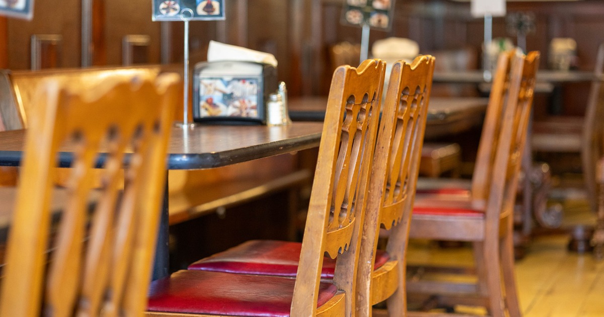 Interior, tables and chairs in dining area