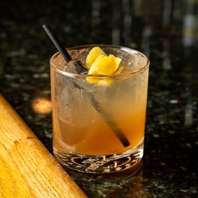 Tamarind amaretto sour on a bar counter.