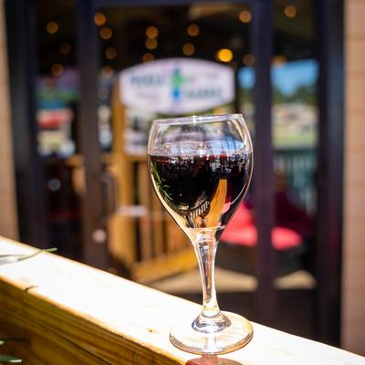 A glass of red wine.