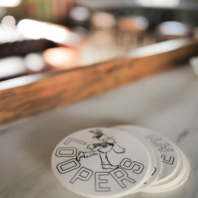 Glass coasters with the company logo.