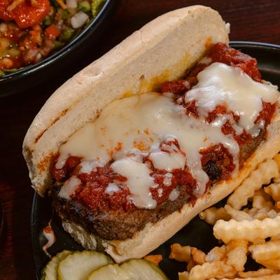 Meatloaf sandwich served with crinkle fries.