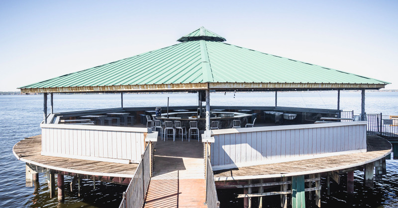 Exterior, covered seating area with a bar