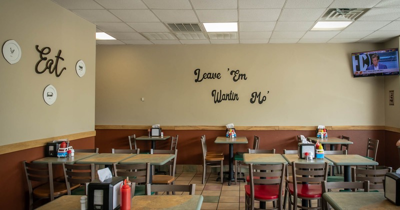 Interior, dining area, tables and chairs, tv screen in the corner