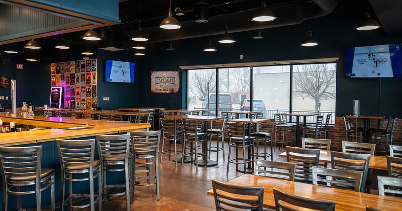 Spacious sports bar interior, seating area and bar
