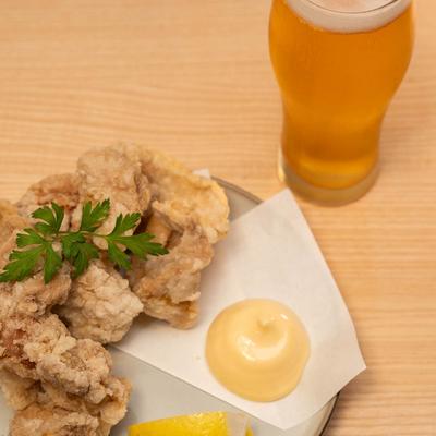 Fried chicken and a glass of beer.