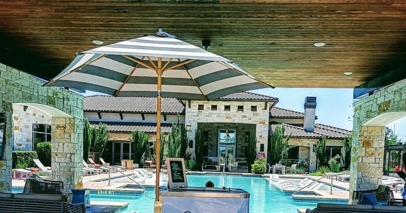 Exterior, ice cream cart and a pool in the background