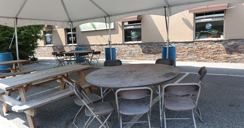Covered patio with tables and chairs