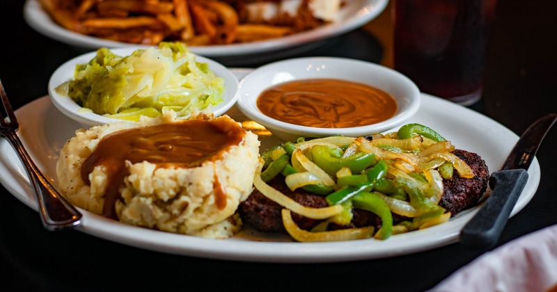 Hamburger Steak, with mashed potatoes, gravy, sauteed veggies, and salad