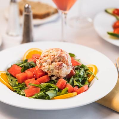 Lobster salad over arugula watermelon mix.